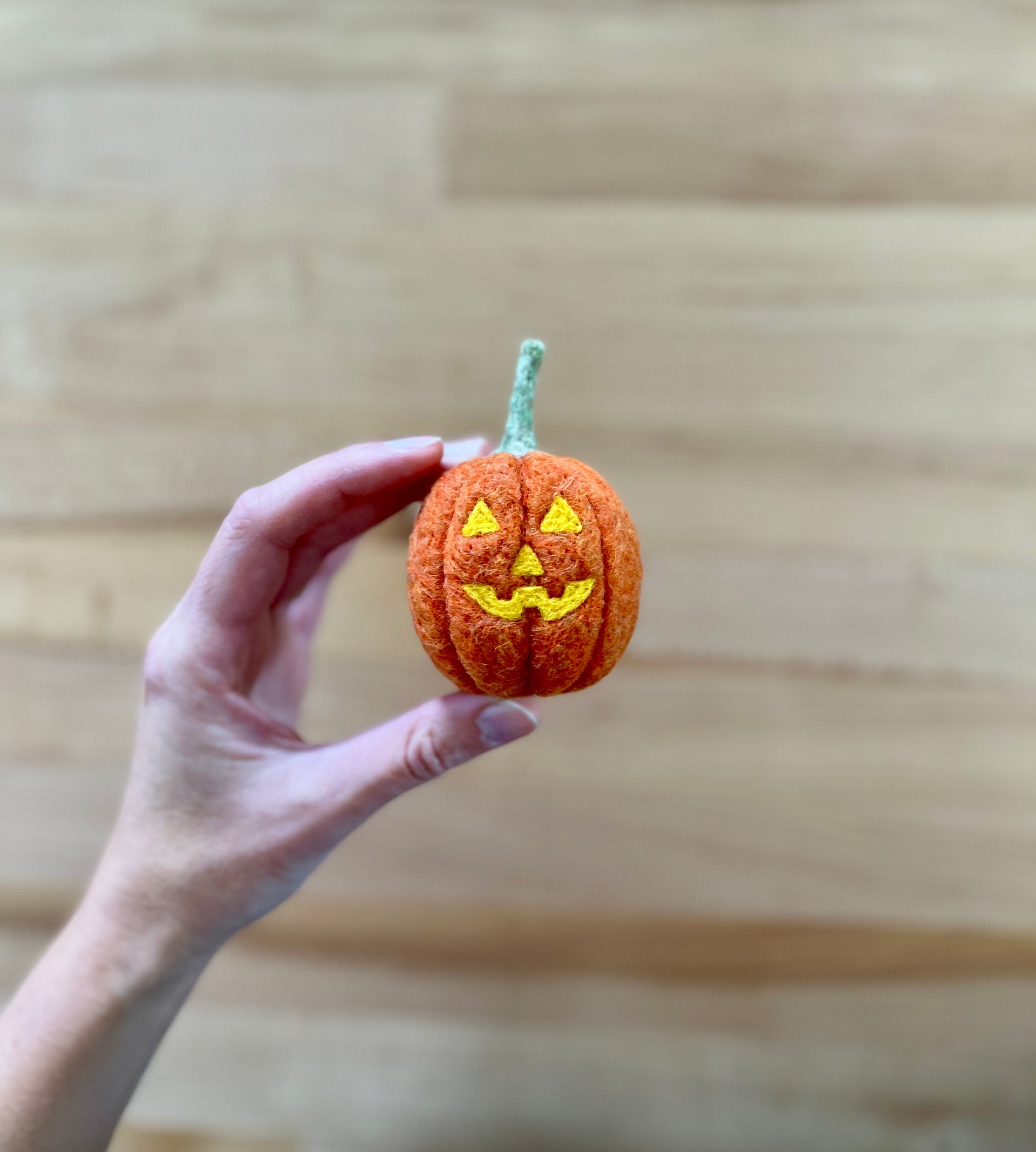 Load video: Learn how to add a needle felted Jack-o&#39;-lantern face to your felted pumpkin!